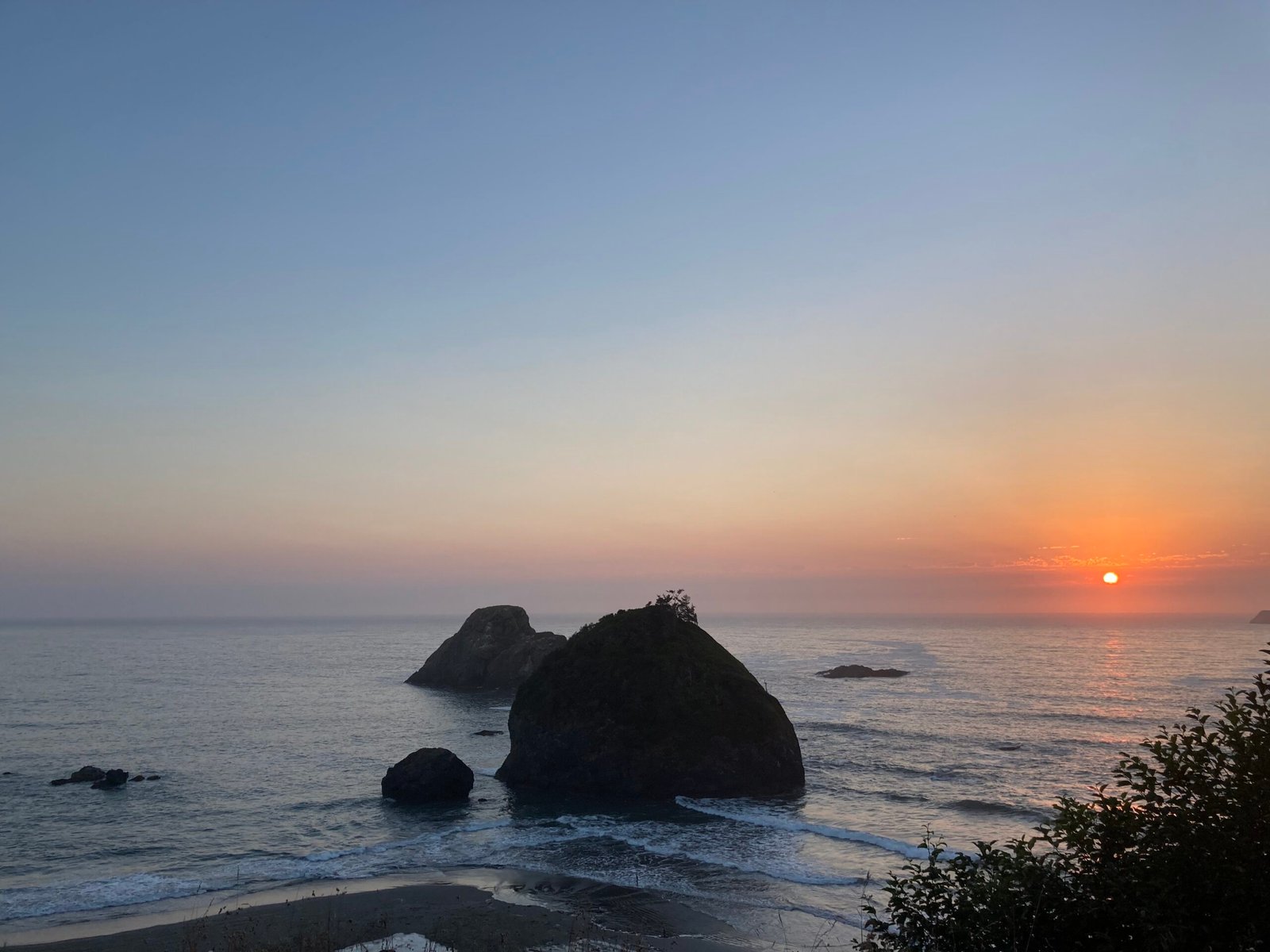 Rock in the sea and sunset