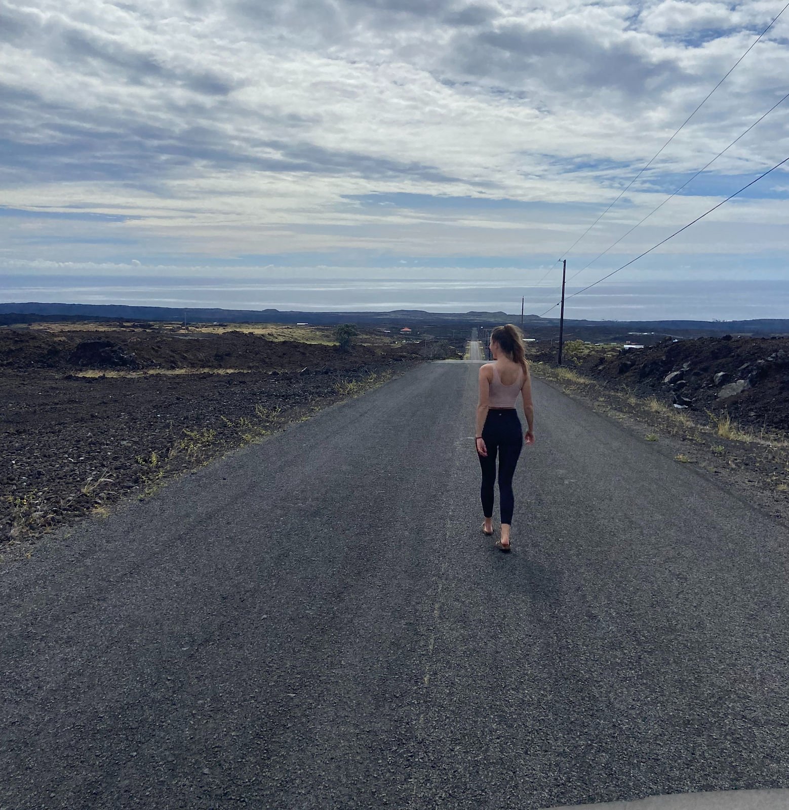woman walking on a road