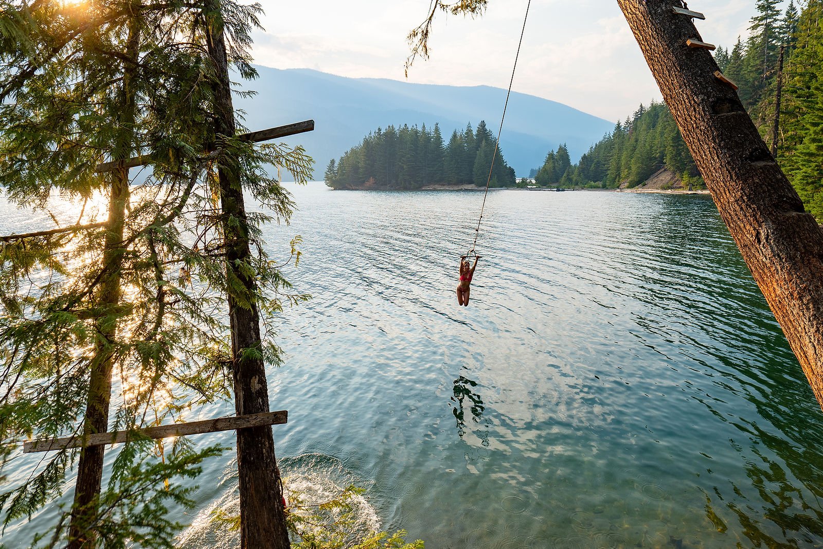 Gils on a swing in the water